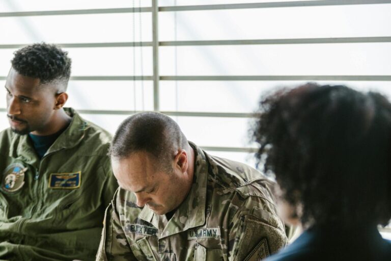 Service members talking in a group therapy session